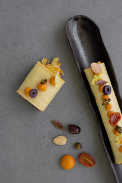 Cold cannelloni with escarole, cod and romesco salad