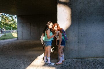 Students using smartphone in university campus