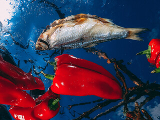 Still life, dry fish with red pepper.
