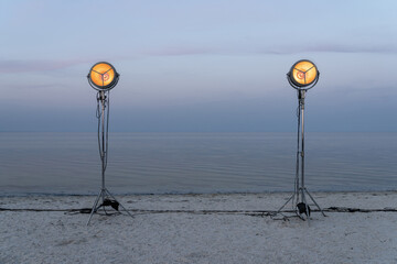 Lighting lamps on light stands at seashore