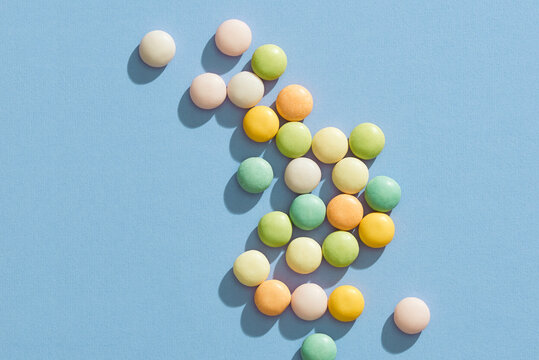 Multicolored macaroons on pink background