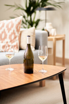 Wine bottle and two glasses.