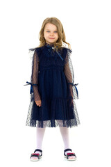 Fototapeta premium Cute little serious girl posing with arms crossed