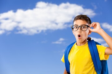 Cute little boy go wear bag and uniform on the background