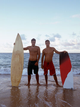 Portrait of young surfers in maui beach shore