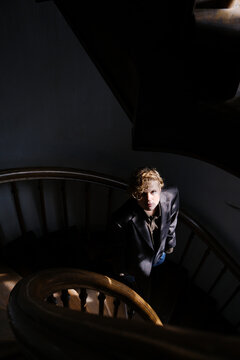 Girl ging down the wodden stairs