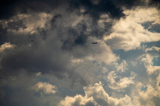 A Passenger Jet Takes Off Into Stormy Clouds.