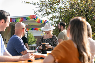 Beer: Woman Brings Drinks To Friends