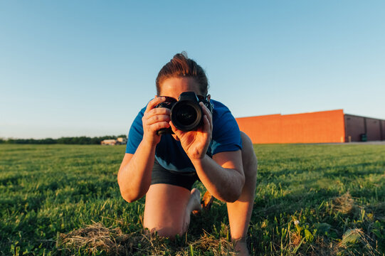 Person taking a picture with camera. 