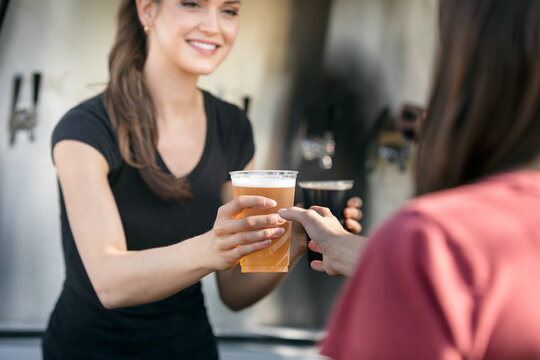 Beer: Woman Serves Up Lager