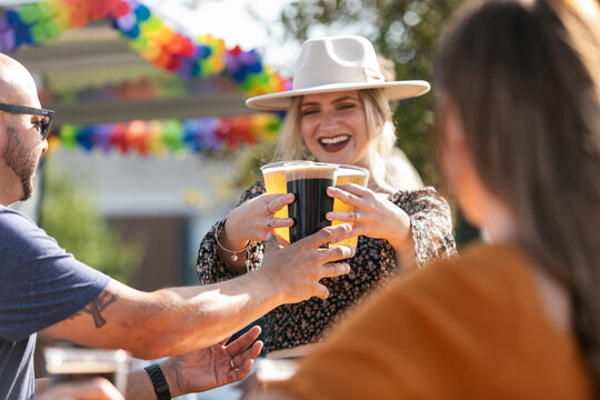 Beer: Woman Brings Drinks To Friends