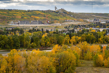 The Bow River valley and the Trinity development during autumn colours in Calgary Alberta Canada.