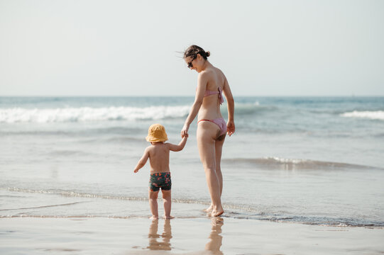 Mother with son on beach