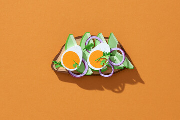 Healthy toast with avocado and egg made form paper