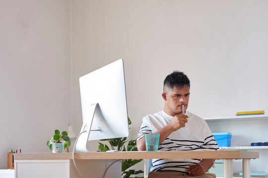 Pensive man working in office