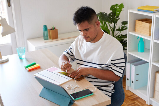 Down syndrome businessman in office