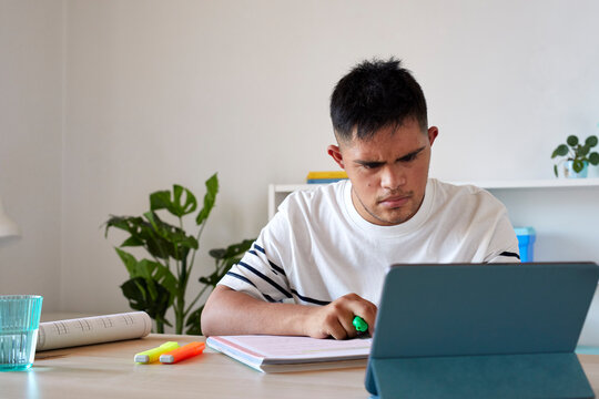 Man with disability studying online