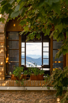 Moutain view through window in old country house