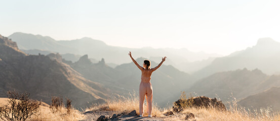 Woman enjoying freedom in mountains