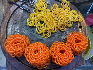 Close view of Jilaibi piled up ,a popular sweet in a shop