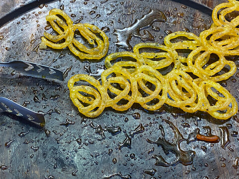 Close view of Jilaibi piled up ,a popular sweet in a shop