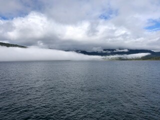 Low clouds over the ocean on Vancouver Island. Pacific ocean near Port Renfrew in Canada