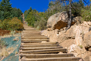 Wooden steps leading up to the top of Manitou Incline. Manitou Springs Incline is a popular hiking...