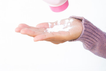 Pour the powder palm with white background. apply for prevent damp and rash. cosmetic for health and beauty concept.