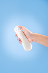 Female hand with applied cream on beige background. Concept of  Winter skin care.