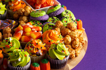 Halloween Themed Charcuterie Board on a Dark Purple Background