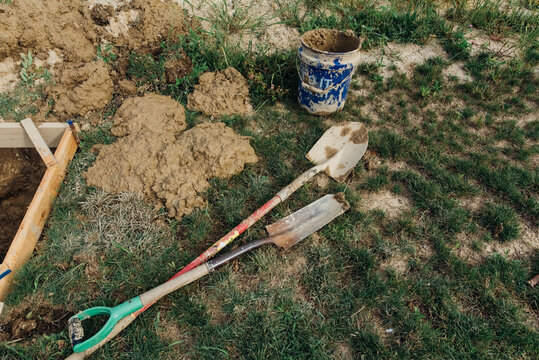 Hand tools muddy from work. 