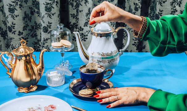 Stylish female hands  at tea time/party