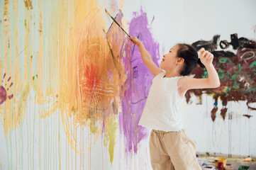 girl drawing on the wall