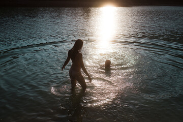 Nude couple having a summer swim 