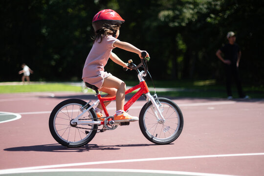 Child riding bike in park