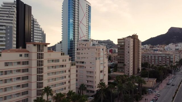 Beautiful paning drone clip of  luxurious hotels and apartment blocks in the city of Calpe in Spain