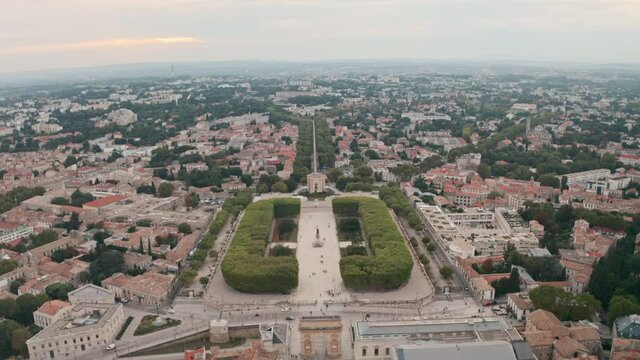 Dolly back drone shot from promenade de peyrou to Montpellier arc de triomphe France