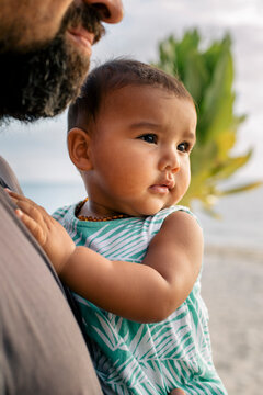 Baby Girl Held by Father