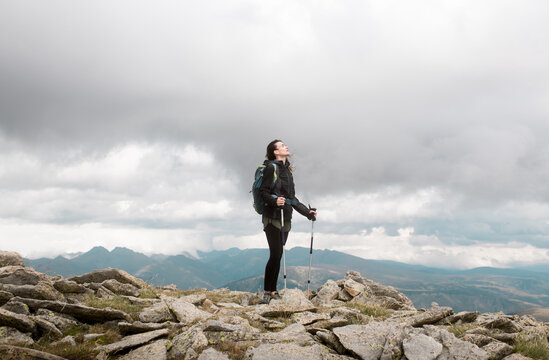 Trekker breathing the fresh air of the mountain