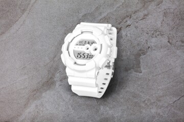 Men watch breaks rocks, advertising product conceptual