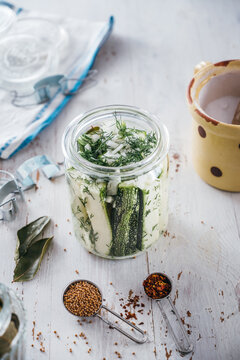 Food Canning sliced and herbed zucchini in jars