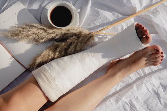 Broken Foot In Cast, Coffee, Pampas Grass And Notebook