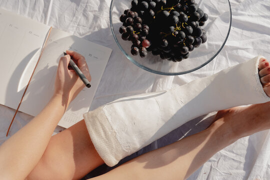 Woman With Broken Leg In Cast Journaling 