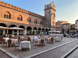 Piazza delle Erbe with historical palaces and church, Mantova, Italy