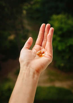 Hand with dose of supplements
