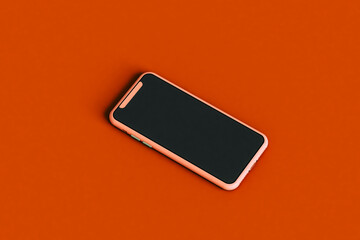 a smartphone on red background