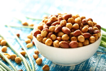 Bowl of delicious roasted and salted organic peanuts,