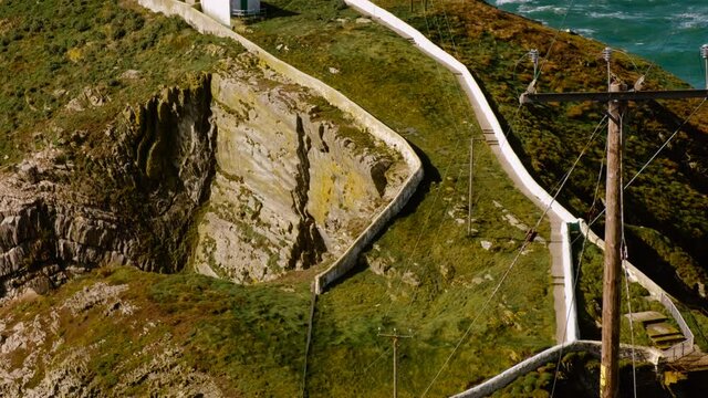 Close-up view of the South Stack Lighthouse on a small island off the north-west coast of Holy Island, Anglesey, Wales, UK