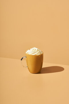 Cup of latte with whipped cream
