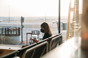 Traveler browsing smartphone at airport